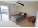 Cozy bedroom with ceiling fan and en-suite bathroom access at 3333 Ramblewood Ct, Sarasota, FL 34237