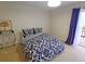 Bright bedroom with a comfy bed and access to a private balcony at 3333 Ramblewood Ct, Sarasota, FL 34237