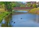 Charming canal view featuring a wooden footbridge at 3333 Ramblewood Ct, Sarasota, FL 34237