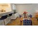 Dining area with breakfast bar and hardwood floors at 3333 Ramblewood Ct, Sarasota, FL 34237