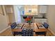 View of dining area and kitchen with hardwood floors at 3333 Ramblewood Ct, Sarasota, FL 34237