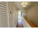 Hallway with wood flooring and access to bedrooms at 3333 Ramblewood Ct, Sarasota, FL 34237