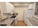 Efficient galley kitchen with granite countertops and appliances at 3333 Ramblewood Ct, Sarasota, FL 34237