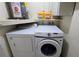 Laundry closet with washer, dryer and shelving at 3333 Ramblewood Ct, Sarasota, FL 34237