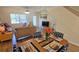 Light-filled living room with hardwood floors, sofa, and dining table at 3333 Ramblewood Ct, Sarasota, FL 34237