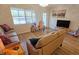 Spacious living room boasts hardwood floors and ample natural light at 3333 Ramblewood Ct, Sarasota, FL 34237