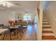 Open living and dining area with hardwood floors and stairs at 3333 Ramblewood Ct, Sarasota, FL 34237