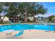 Inviting community pool with surrounding lounge chairs at 3333 Ramblewood Ct, Sarasota, FL 34237