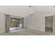 Bedroom with sliding doors leading to a deck and pool at 3726 Beneva Oaks Blvd, Sarasota, FL 34238