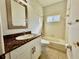 Bathroom features granite countertop, single sink, and bathtub at 408 Golden Harbour Trl, Bradenton, FL 34212