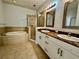 Bathroom boasts double sinks, granite countertop, soaking tub, and shower at 408 Golden Harbour Trl, Bradenton, FL 34212