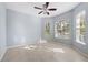 Spacious bedroom with tile floors, ceiling fan, and large windows at 408 Golden Harbour Trl, Bradenton, FL 34212