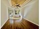 Bright bedroom with wood-look floors and sliding glass doors leading to the backyard at 408 Golden Harbour Trl, Bradenton, FL 34212