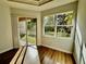 Bedroom with large window and door leading to backyard at 408 Golden Harbour Trl, Bradenton, FL 34212