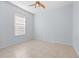 Bedroom with tile flooring, ceiling fan, and window with blinds at 408 Golden Harbour Trl, Bradenton, FL 34212