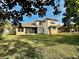 Two-story house with large backyard and screened patio at 408 Golden Harbour Trl, Bradenton, FL 34212