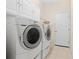 Laundry room with washer, dryer, cabinets, and additional storage at 408 Golden Harbour Trl, Bradenton, FL 34212