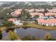 Aerial view of community, pool, and tennis court at 4216 Central Sarasota Pkwy # 1326, Sarasota, FL 34238