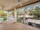Screened balcony with outdoor furniture and partial view at 4216 Central Sarasota Pkwy # 1326, Sarasota, FL 34238