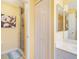 Bathroom with a walk-in shower, linen closet, and updated vanity at 4216 Central Sarasota Pkwy # 1326, Sarasota, FL 34238