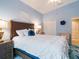 Guest bedroom with a queen-size bed and ceiling fan at 4216 Central Sarasota Pkwy # 1326, Sarasota, FL 34238