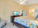 Bedroom with a queen-size bed, a ceiling fan, and plenty of natural light at 4216 Central Sarasota Pkwy # 1326, Sarasota, FL 34238