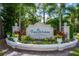 Welcoming entrance sign for Plaza De Flores community at 4216 Central Sarasota Pkwy # 1326, Sarasota, FL 34238