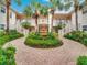 Community courtyard with fountain and lush landscaping at 4216 Central Sarasota Pkwy # 1326, Sarasota, FL 34238