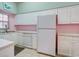 White kitchen with dishwasher and refrigerator at 4216 Central Sarasota Pkwy # 1326, Sarasota, FL 34238