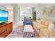 Open living room with view of kitchen and dining area at 4216 Central Sarasota Pkwy # 1326, Sarasota, FL 34238