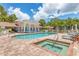 Inviting pool and spa area with lounge chairs at 4216 Central Sarasota Pkwy # 1326, Sarasota, FL 34238