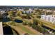 Aerial view showing community, golf course and water features at 4570 Pinebrook Cir # 303, Bradenton, FL 34209