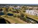 Aerial view of community near golf course and water at 4570 Pinebrook Cir # 303, Bradenton, FL 34209