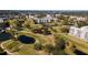 Aerial view of community with golf course and multiple residential buildings at 4570 Pinebrook Cir # 303, Bradenton, FL 34209