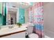 Clean bathroom with a shower/tub combo and vanity at 4570 Pinebrook Cir # 303, Bradenton, FL 34209