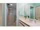 Bright bathroom with a vanity, a large mirror, and a shower at 4570 Pinebrook Cir # 303, Bradenton, FL 34209
