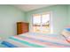 Bright bedroom with large window and wood flooring at 4570 Pinebrook Cir # 303, Bradenton, FL 34209