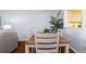Dining area with wood table and white chairs at 4570 Pinebrook Cir # 303, Bradenton, FL 34209