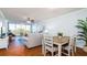 Dining area with wood table and white chairs at 4570 Pinebrook Cir # 303, Bradenton, FL 34209