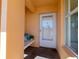 Covered entryway with a bench and room for plants at 4570 Pinebrook Cir # 303, Bradenton, FL 34209