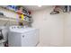 Convenient laundry room with washer, dryer, and shelving at 4570 Pinebrook Cir # 303, Bradenton, FL 34209