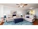 Living room with comfy sofas, and a blue area rug at 4570 Pinebrook Cir # 303, Bradenton, FL 34209