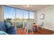 Bright sunroom with golf course view, comfy seating, and wood floors at 4570 Pinebrook Cir # 303, Bradenton, FL 34209