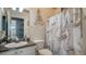 Well-maintained bathroom with a marble-themed shower curtain and an Eiffel Tower decoration at 4802 51St W St # 1118, Bradenton, FL 34210