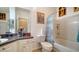 Bathroom with vanity, toilet, and shower-tub combo with decorative curtain at 4802 51St W St # 1118, Bradenton, FL 34210