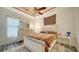 Bedroom featuring decorative ceiling and large, mirrored dresser at 4802 51St W St # 1118, Bradenton, FL 34210