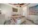 Bedroom with ceiling fan, patterned rug, and decorative accents at 4802 51St W St # 1118, Bradenton, FL 34210