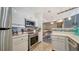 Bright kitchen featuring stainless steel appliances and stylish tile backsplash at 4802 51St W St # 1118, Bradenton, FL 34210