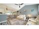 Open-concept living room features vaulted ceilings, modern furniture, and a seamless flow into the kitchen at 4802 51St W St # 1118, Bradenton, FL 34210