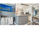 Open concept living space with mounted TV and view of the kitchen at 4802 51St W St # 1118, Bradenton, FL 34210